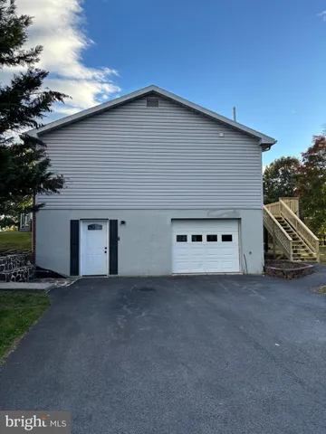 a front view of house with deck