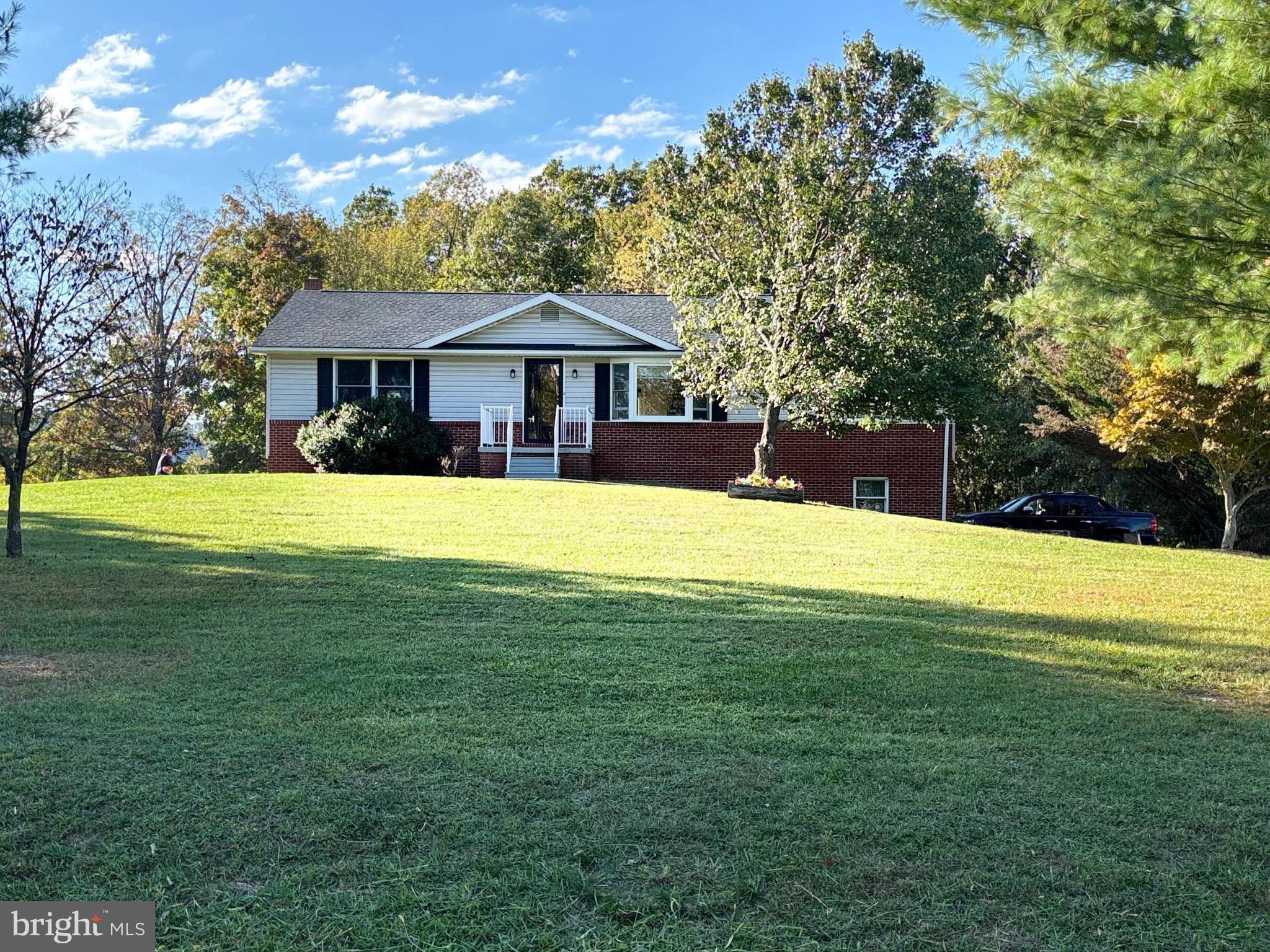 25 Nelson Lane Berkeley Springs, WV 25411 - Photo 3 of 27 a view of a house with a yard