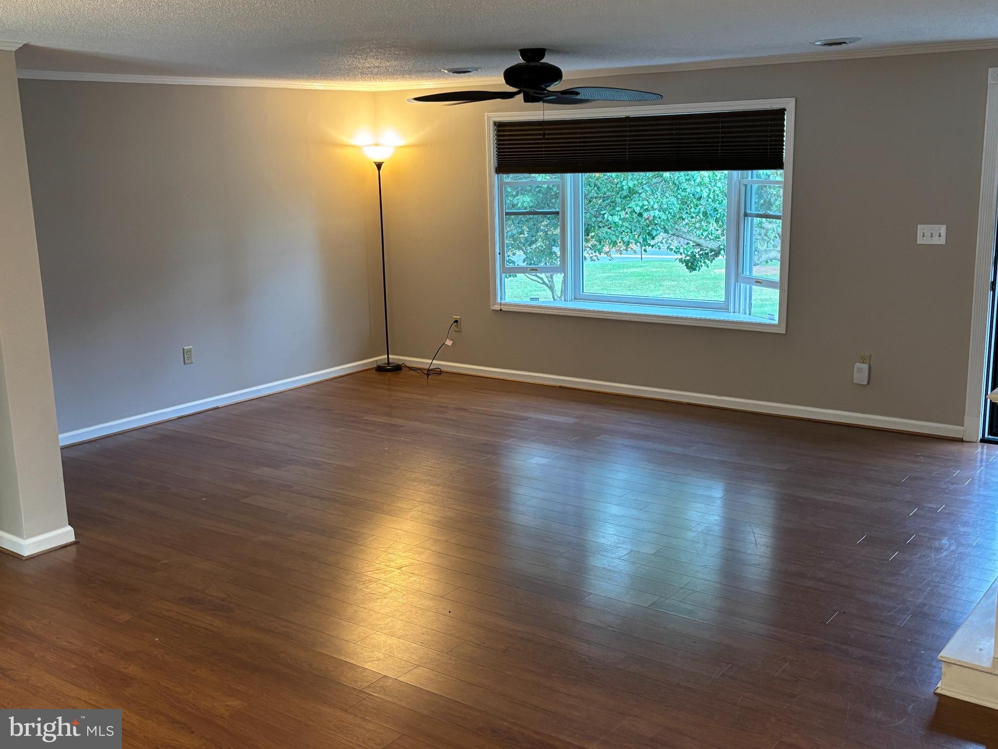 25 Nelson Lane Berkeley Springs, WV 25411 - Photo 4 of 27 an empty room with wooden floor and windows