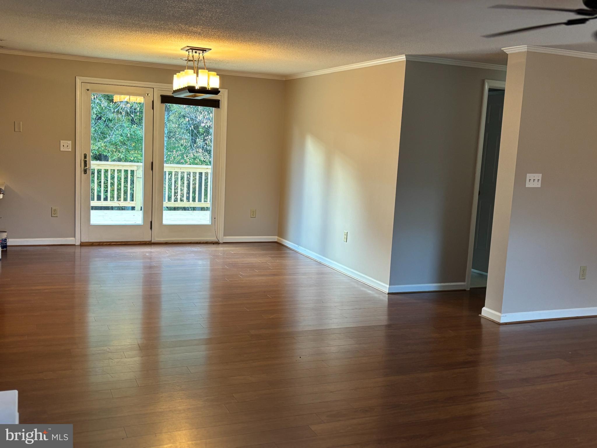 25 Nelson Lane Berkeley Springs, WV 25411 - Photo 5 of 27 a view of an empty room with wooden floor and a window