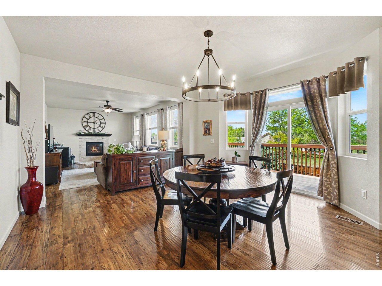 1124 Wagon Bend Road Berthoud, CO 80513 - Photo 7 of 38 dining room facing living room from main hall entry