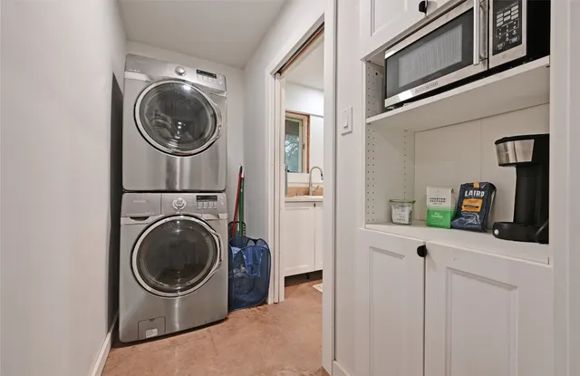 a view of a hallway with washer and dryer
