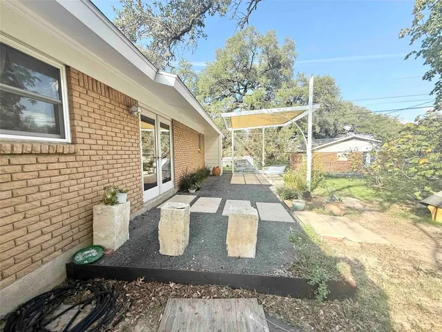 a view of a patio with chair and tables