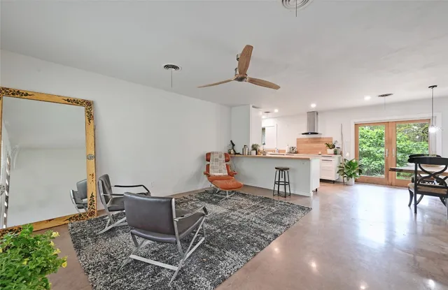 a living room with furniture and a table
