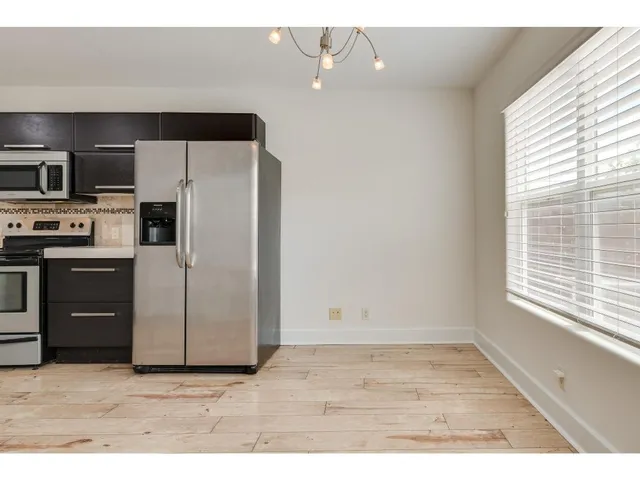 a view of an empty room and a window