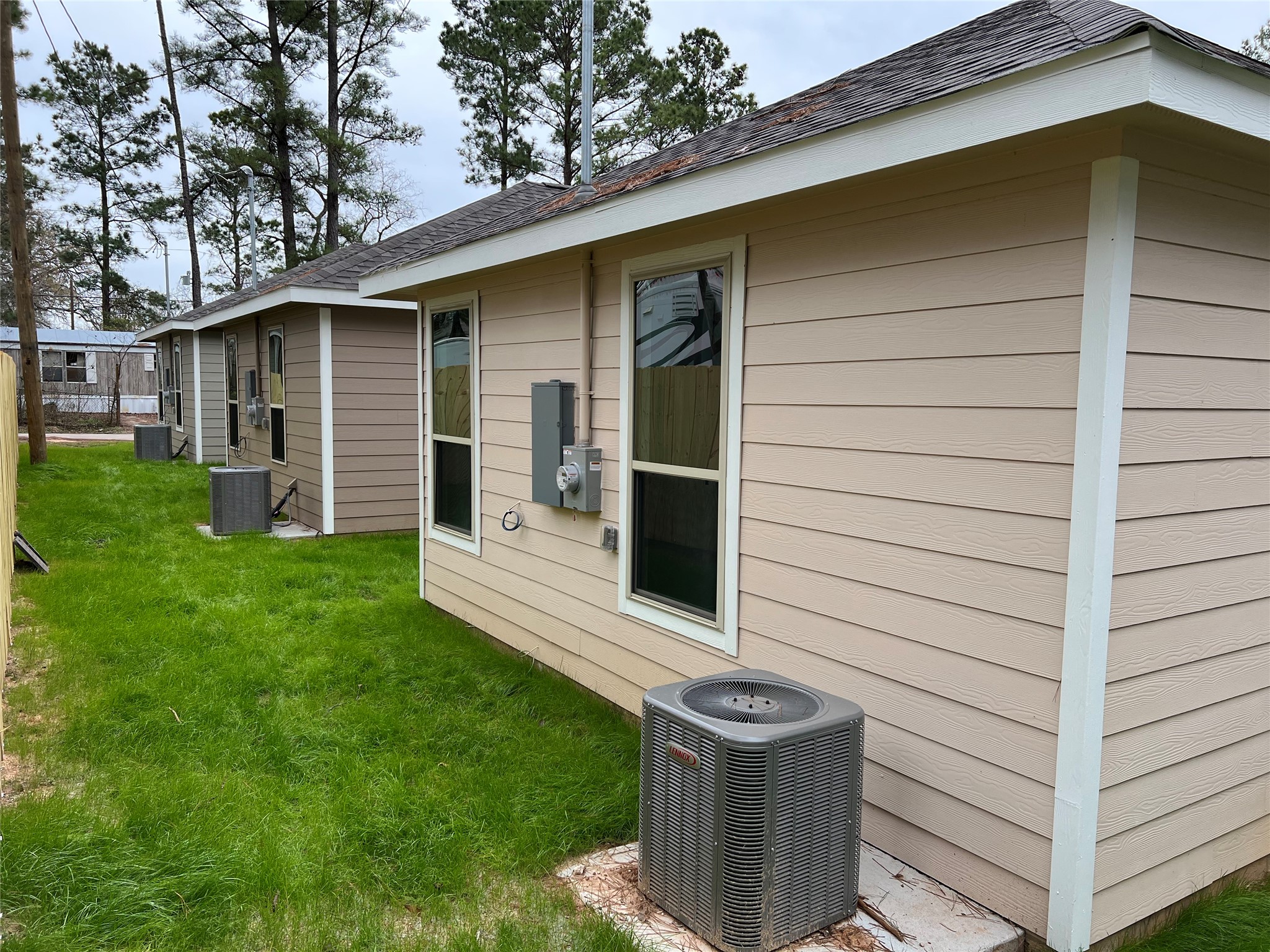 11595 Persimmon Street Willis, TX 77318 - Photo 12 of 14 a view of house with backyard