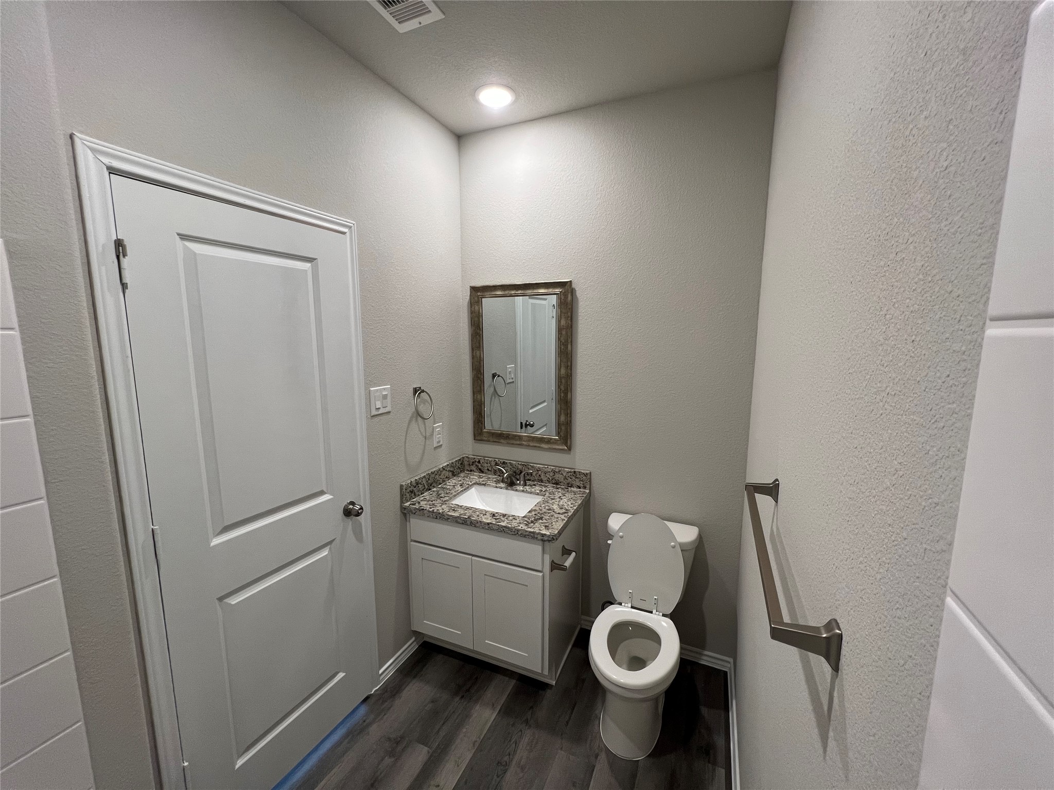 11595 Persimmon Street Willis, TX 77318 - Photo 10 of 14 a bathroom with a toilet and a sink
