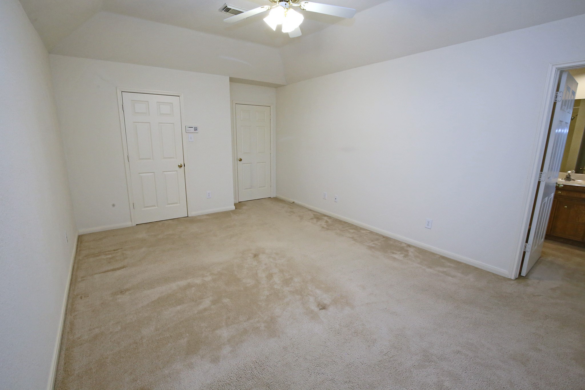 12002 10th Street Santa Fe, TX 77510 - Photo 19 of 35 Primary Bedroom with adjoining ensuite bath.