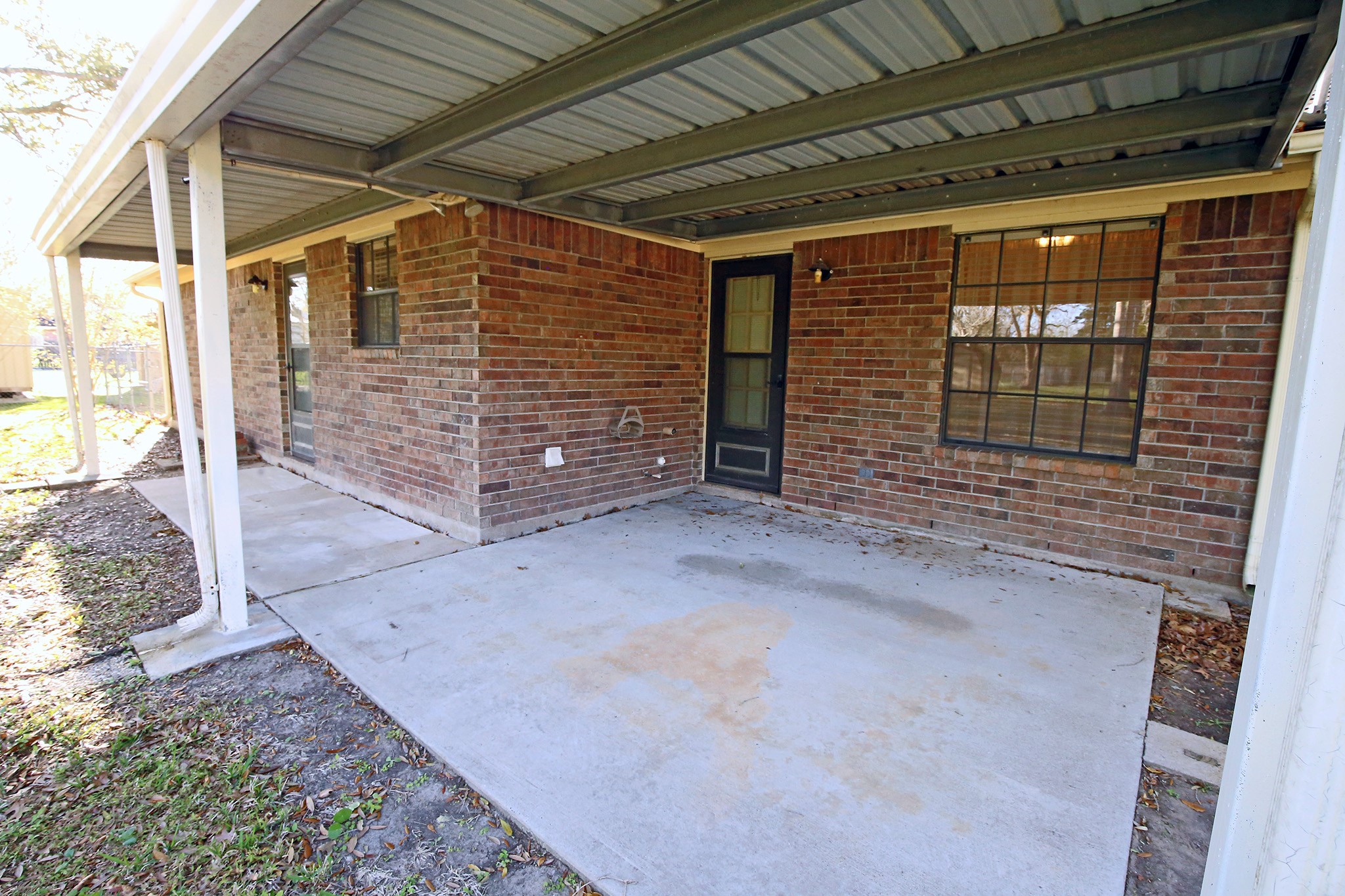 12002 10th Street Santa Fe, TX 77510 - Photo 26 of 35 Come sit outside under the covered porch and have a glass of tea!