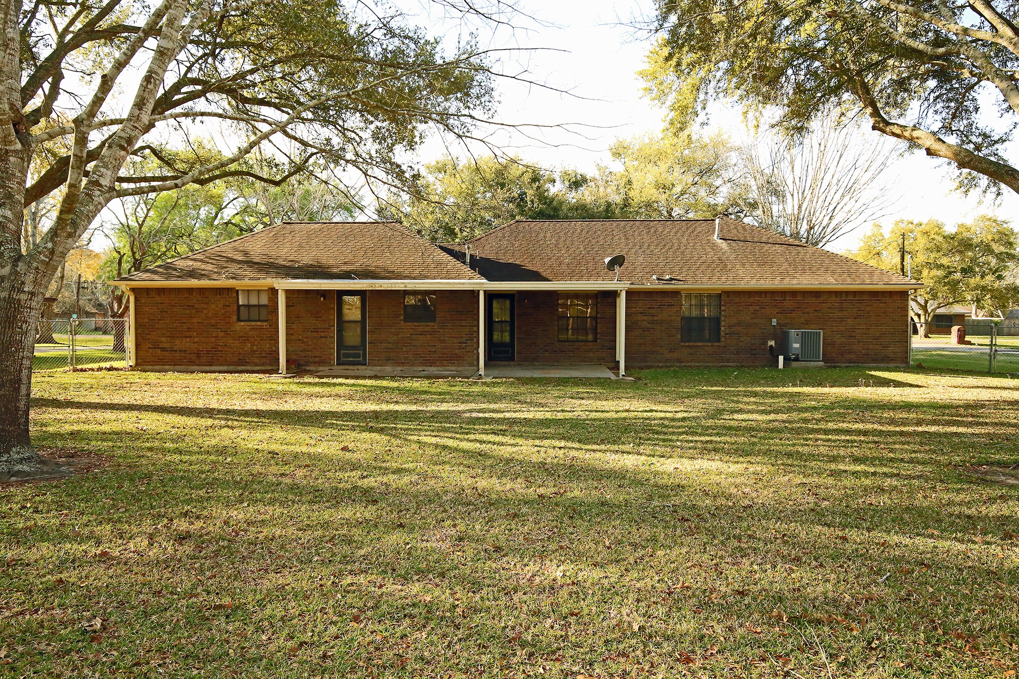 12002 10th Street Santa Fe, TX 77510 - Photo 30 of 35 Lots of shade for those lazy hot days.