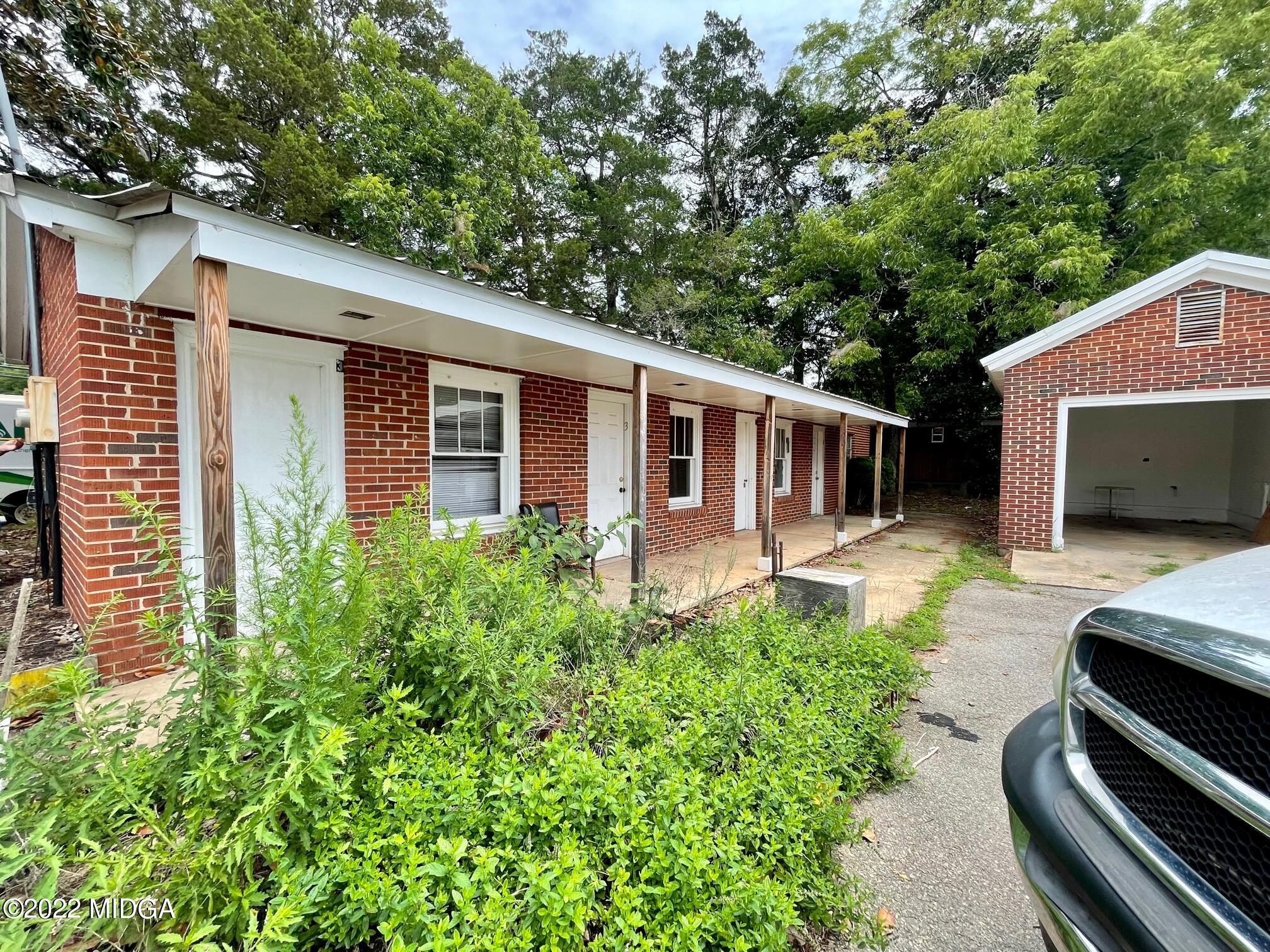 102 Asbell Street Irwinton, GA 31042 - Photo 3 of 8 a backyard of a house with seating space