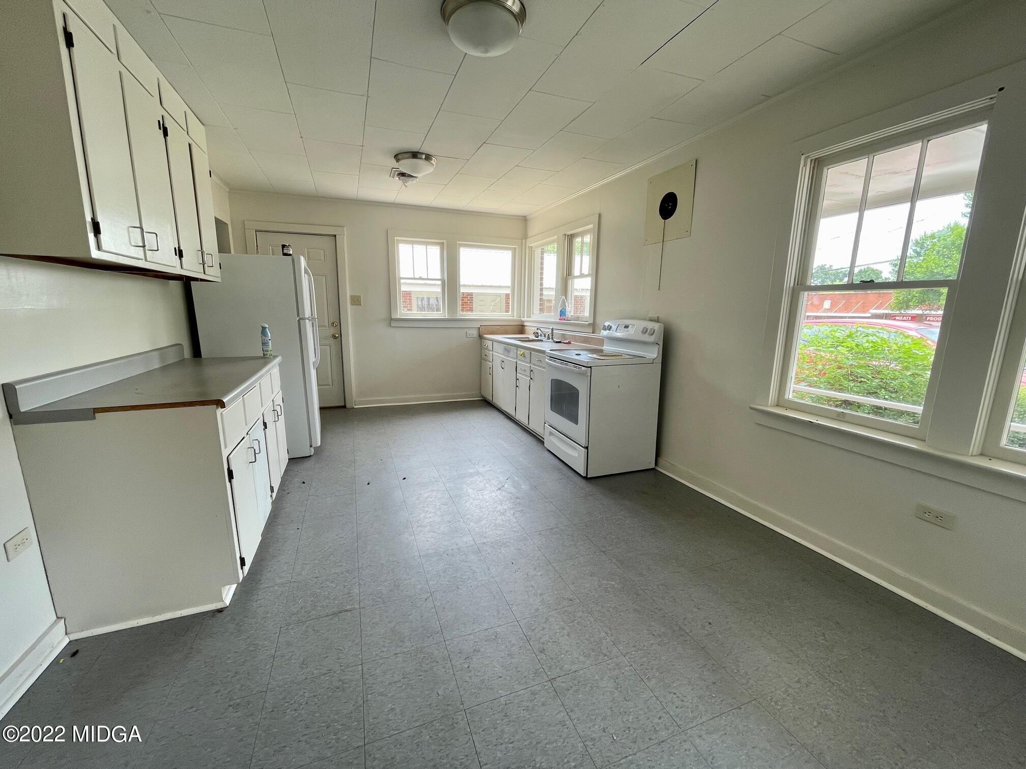 102 Asbell Street Irwinton, GA 31042 - Photo 5 of 8 a view of a kitchen with furniture and windows