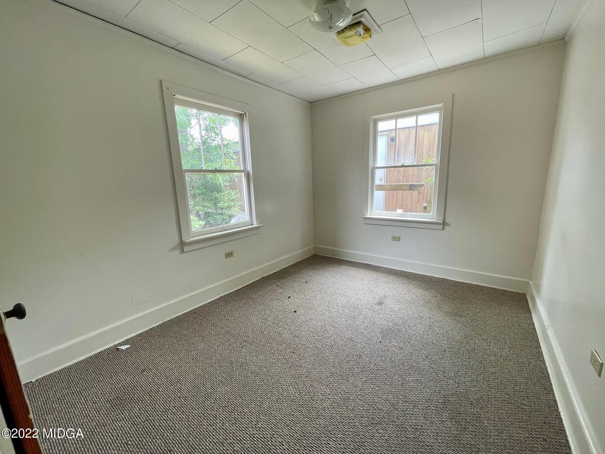 102 Asbell Street Irwinton, GA 31042 - Photo 7 of 8 an empty room with a window