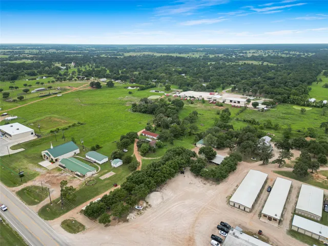 an aerial view of residential houses with outdoor space