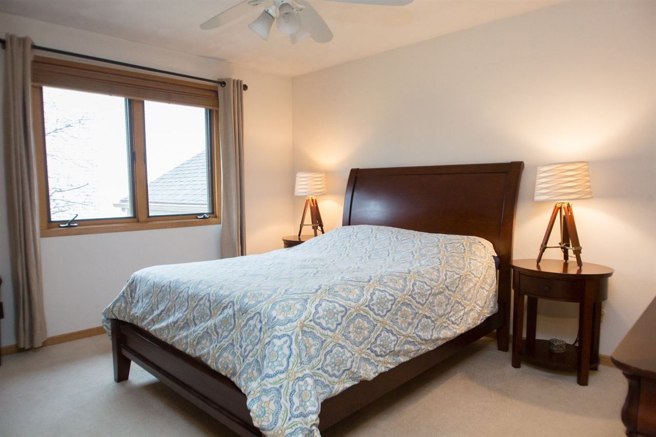7068 Rye Ridge Trail Cherry Valley, IL 61016 - Photo 16 of 23 a bedroom with a bed and window
