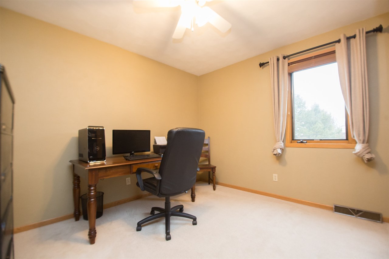 7068 Rye Ridge Trail Cherry Valley, IL 61016 - Photo 19 of 23 a view of a workspace with furniture and a window