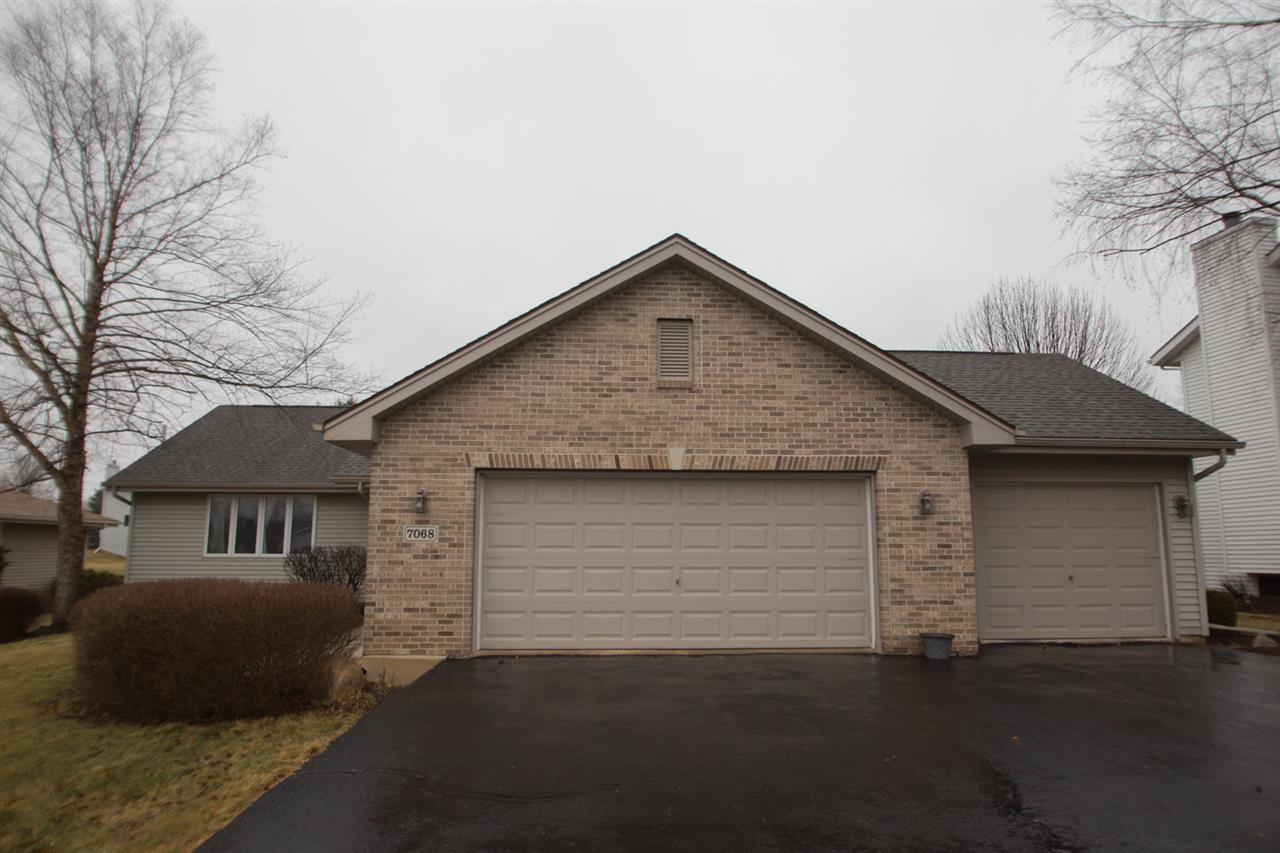 7068 Rye Ridge Trail Cherry Valley, IL 61016 - Photo 3 of 23 a front view of a house with a yard
