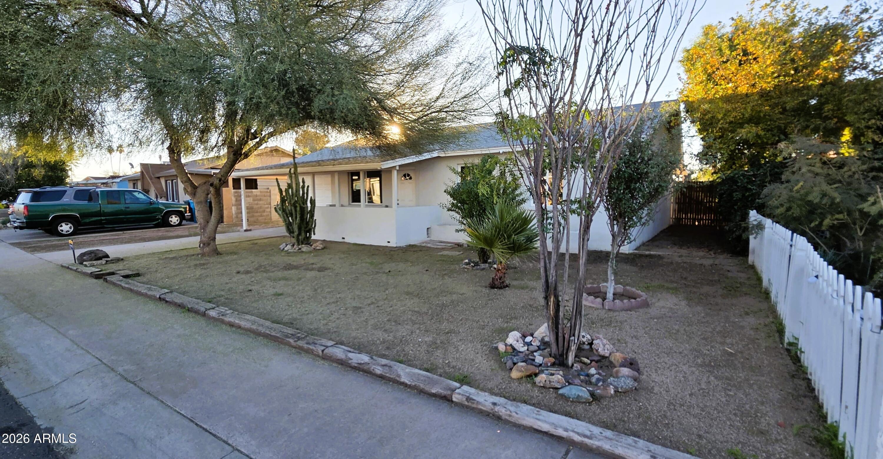 5721 West Cheery Lynn Road Phoenix, AZ 85031 - Photo 2 of 20 a front view of a house with a yard
