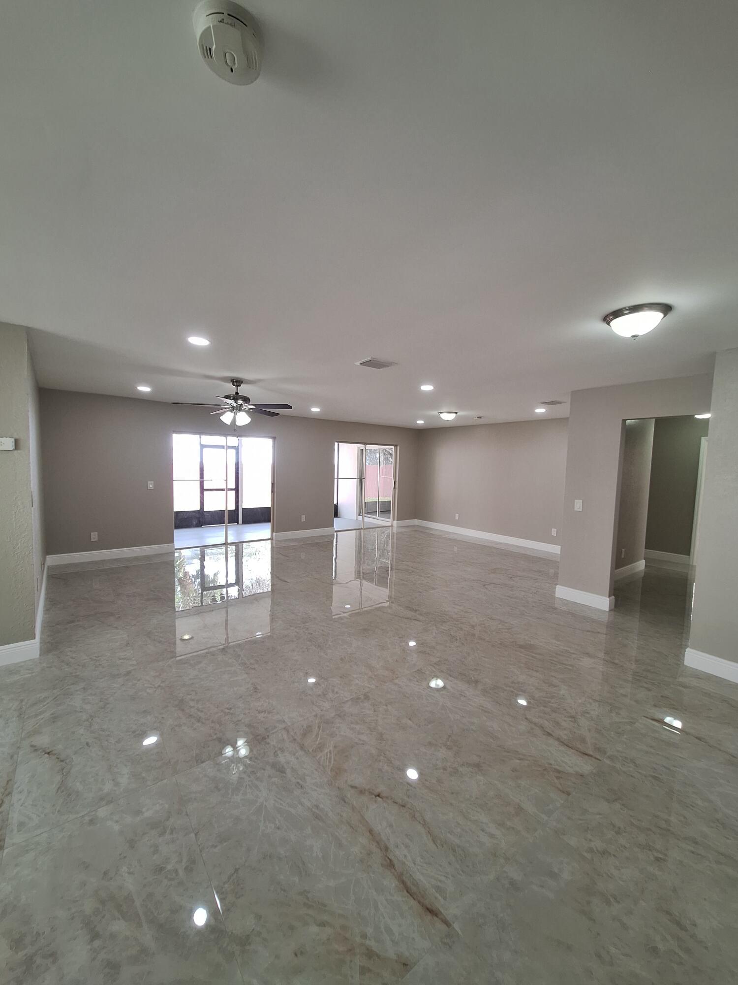 9219 Southwest 1st Place Boca Raton, FL 33428 - Photo 3 of 22 03) Living and Great room combined areas