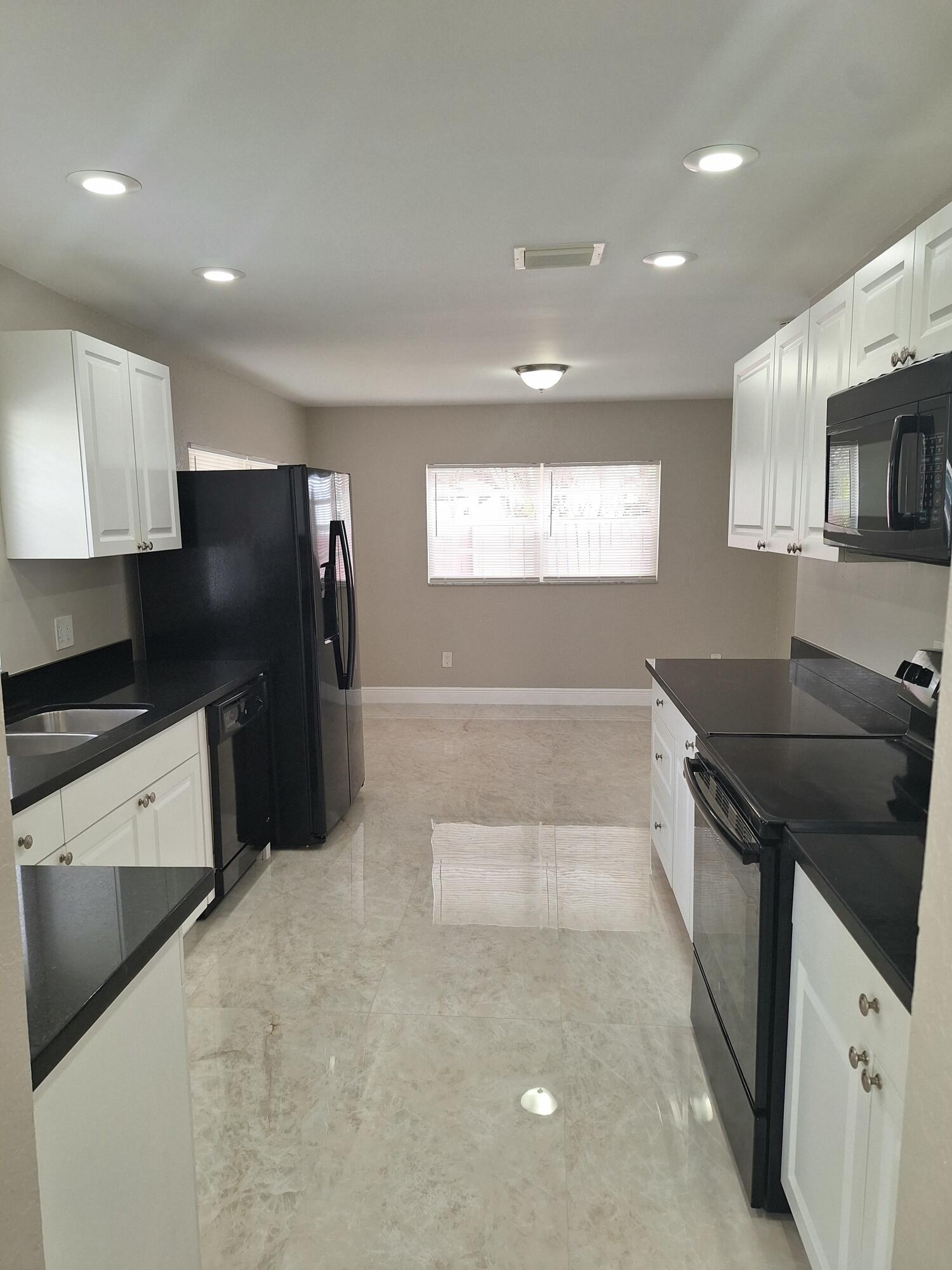 9219 Southwest 1st Place Boca Raton, FL 33428 - Photo 6 of 22 06) Kitchen & Breakfast nook area