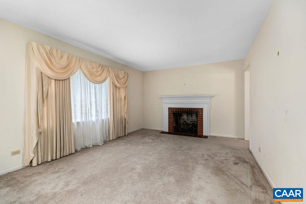 1905 Swanson Drive Charlottesville, VA 22901 - Photo 14 of 37 an empty room with a fireplace and window