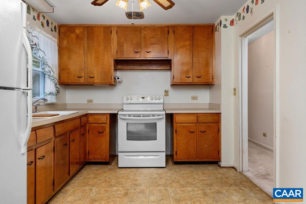 1905 Swanson Drive Charlottesville, VA 22901 - Photo 17 of 37 a kitchen with stainless steel appliances granite countertop a stove a sink and a refrigerator