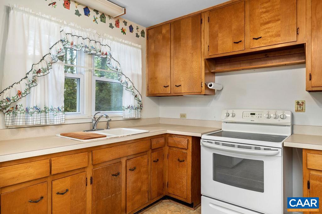 1905 Swanson Drive Charlottesville, VA 22901 - Photo 18 of 37 a kitchen with granite countertop cabinets stainless steel appliances and a sink
