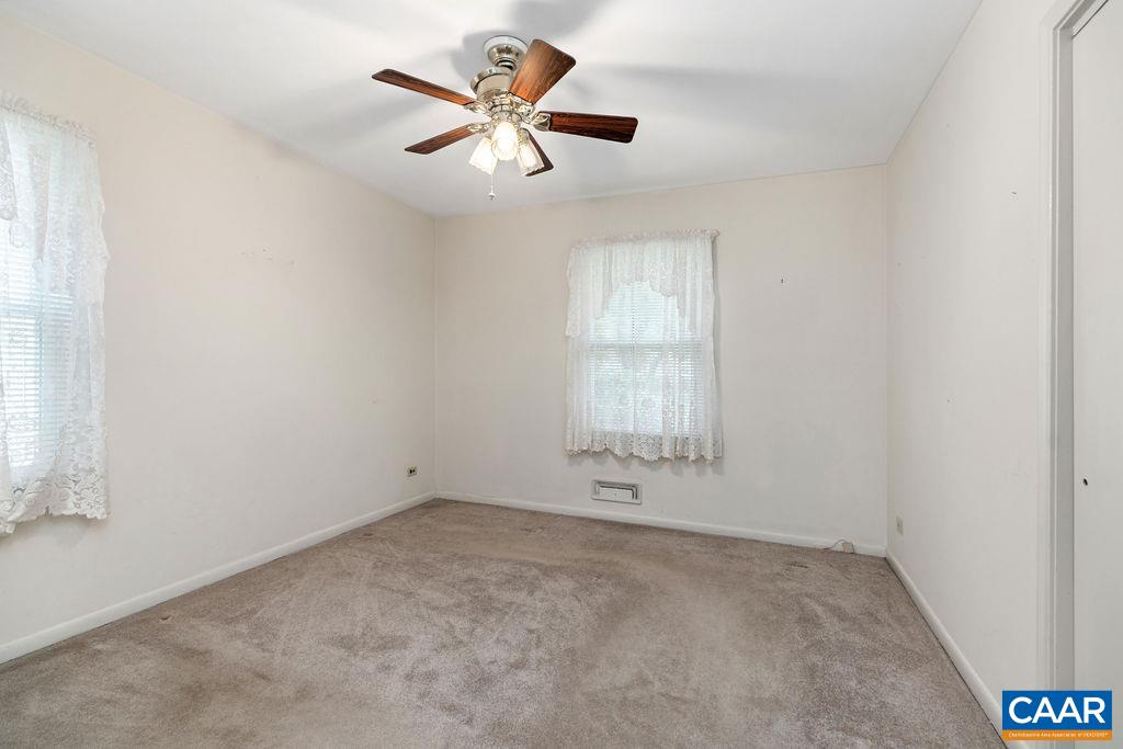 1905 Swanson Drive Charlottesville, VA 22901 - Photo 29 of 37 an empty room with a window and a ceiling fan