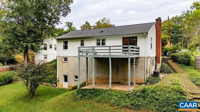 a view of a house with a sink and garden with plants
