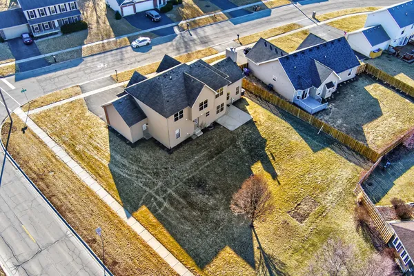 a view of a house with pool and sitting area