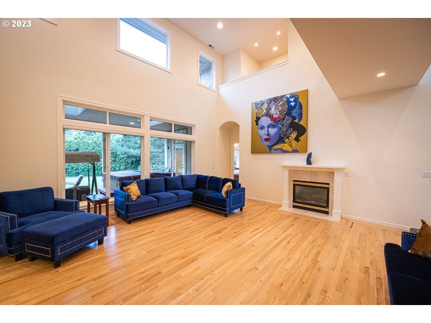 3338 Lakeside Drive Eugene, OR 97401 - Photo 12 of 45 a living room with furniture a flat screen tv and a large window