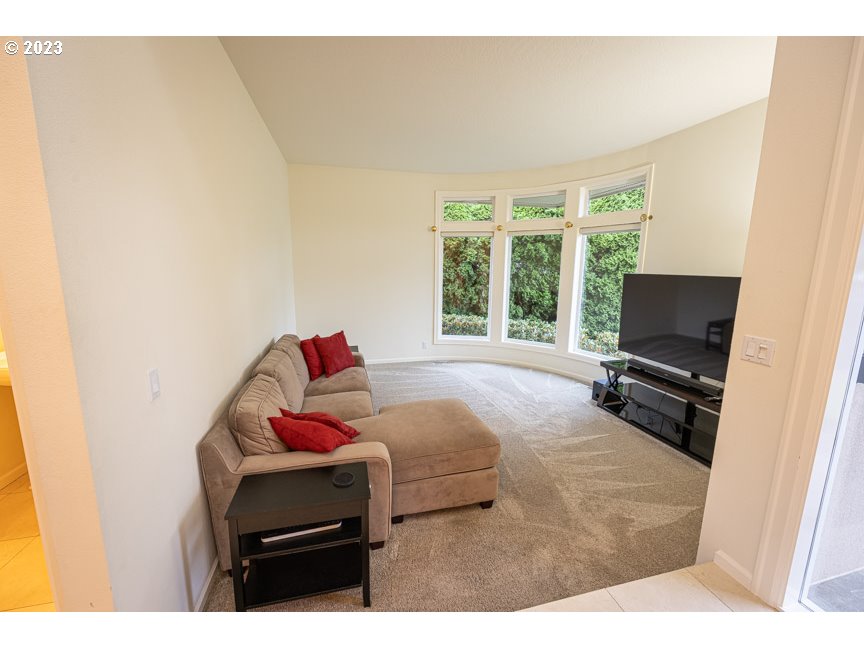 3338 Lakeside Drive Eugene, OR 97401 - Photo 20 of 45 a bedroom with a bed and a flat screen tv