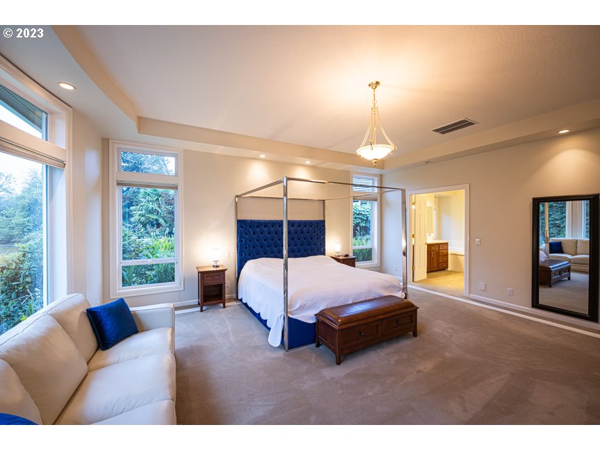 3338 Lakeside Drive Eugene, OR 97401 - Photo 24 of 45 a spacious bedroom with a bed window and couch