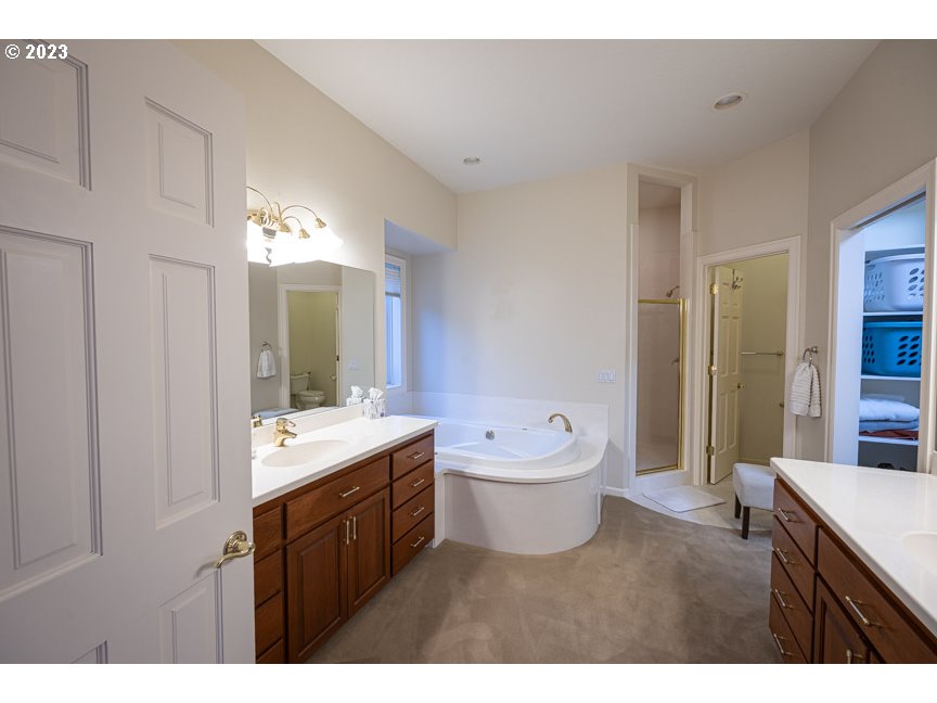 3338 Lakeside Drive Eugene, OR 97401 - Photo 25 of 45 a bathroom with a double vanity sink mirror and toilet