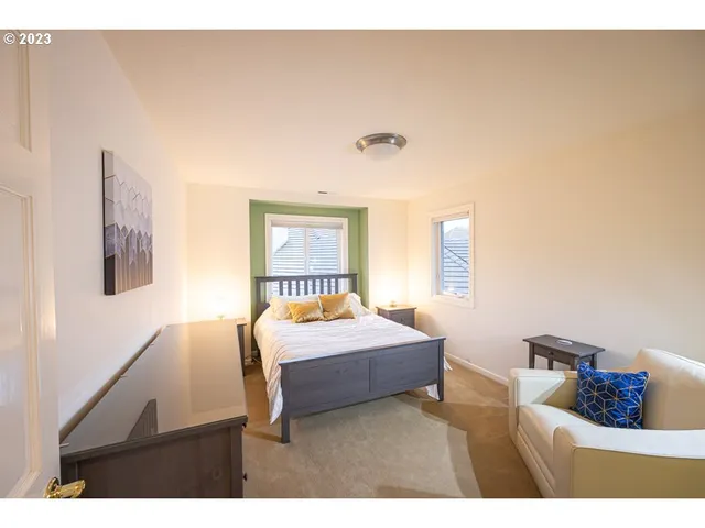 a bedroom with a bed and a night stand