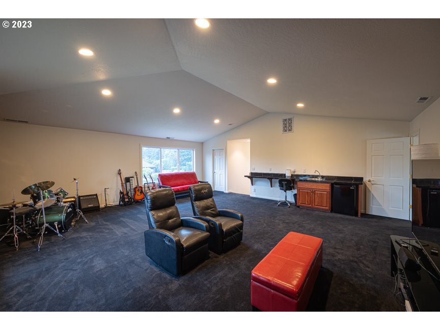 3338 Lakeside Drive Eugene, OR 97401 - Photo 40 of 45 a living room with furniture and a wooden floor