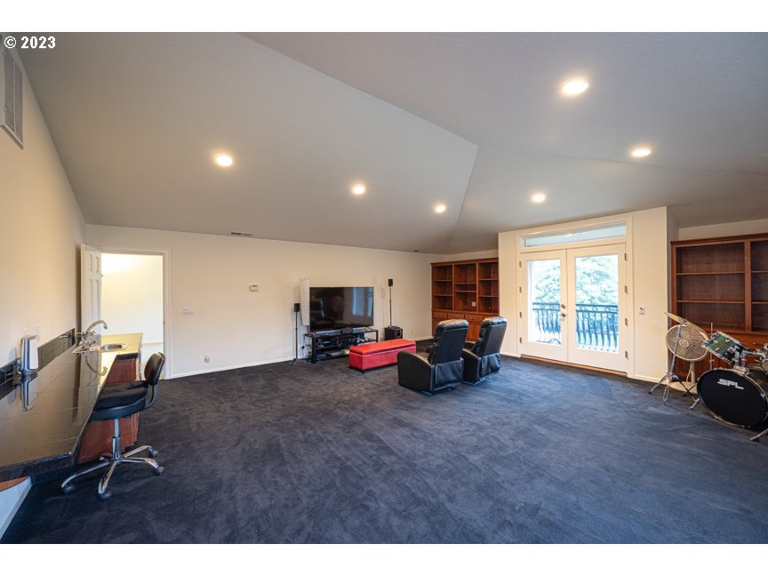 3338 Lakeside Drive Eugene, OR 97401 - Photo 41 of 45 a living room with furniture and a flat screen tv