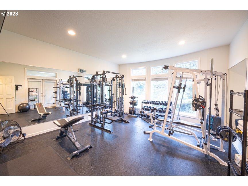 3338 Lakeside Drive Eugene, OR 97401 - Photo 44 of 45 a living room with lots of gym equipment