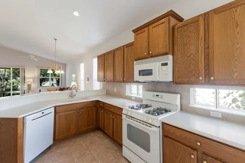 a kitchen with sink and cabinets