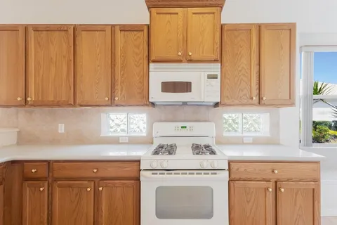 a view of storage and utility room with washer and dryer