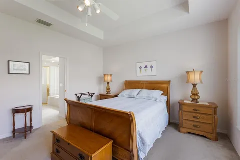 a spacious bathroom with a double vanity sink a large mirror and a bathtub