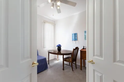 a bedroom with a bed and a table in it