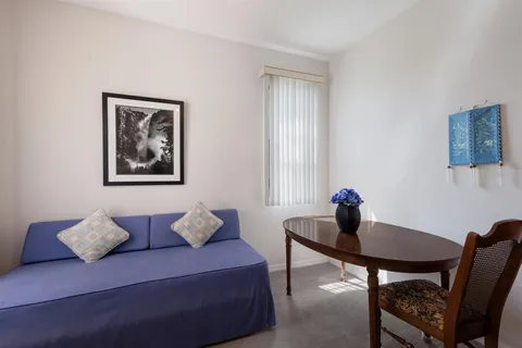 a view of a workspace with furniture