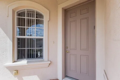 a view of living room with furniture and a window