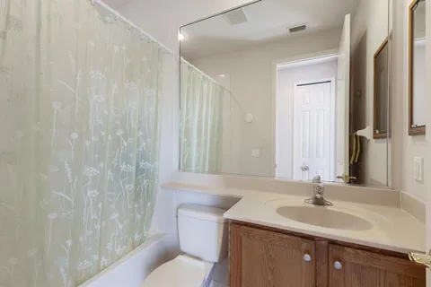 a view of a chair and table in the balcony