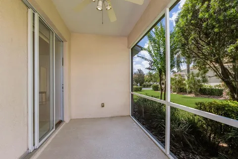 a front view of a house with a garden and plants