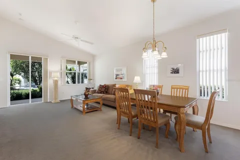 a living room with furniture a window and a table