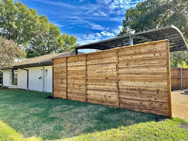 a view of a back yard of the building
