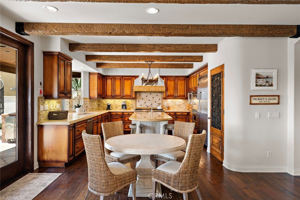 5 Via Monarca Street Dana Point, CA 92629 - Photo 12 of 57 a view of a dining room with furniture and wooden floor