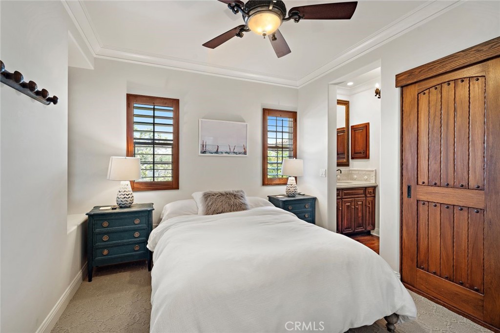 5 Via Monarca Street Dana Point, CA 92629 - Photo 27 of 57 a bedroom with a bed and a chandelier